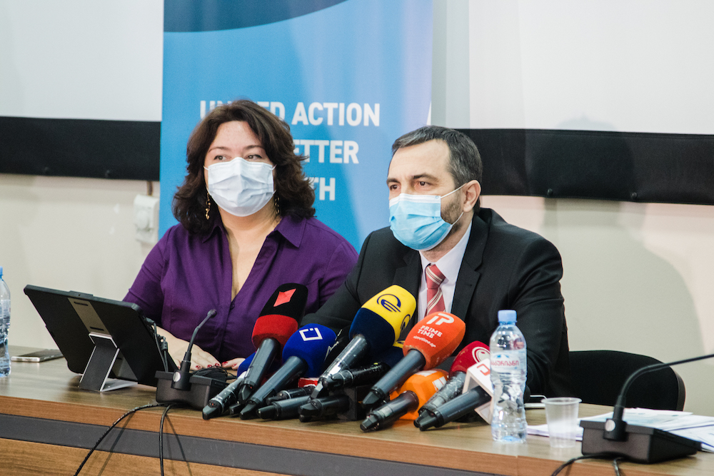 surge page cover Silviu Domente (right, WHO Representative and Head of WHO Country Office to Georgia) and Tamar Kvaratskhelia (left, Communication Consultant) give a speech at a press conference for the arrival of the COVID-19 vaccines