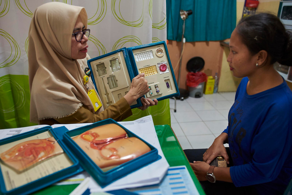 UN0248678- A female counselor speaks to a woman about contraceptive methods, Indonesia