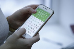 Kazakhstan’s official digital health application Person holding a phone