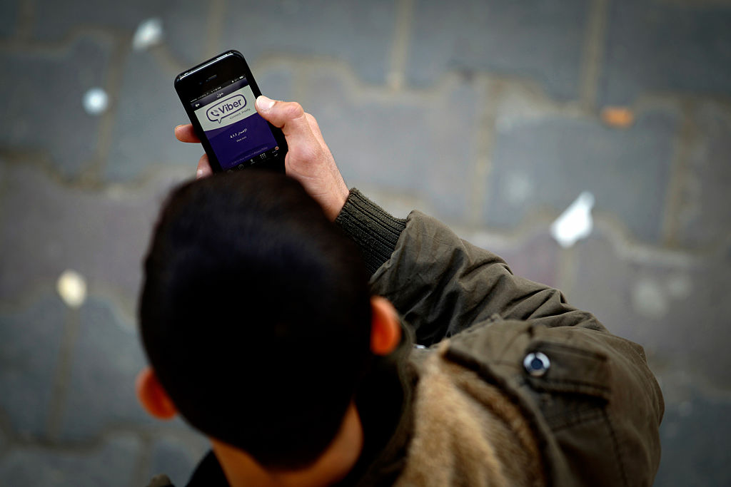Man using Viber app on phone
