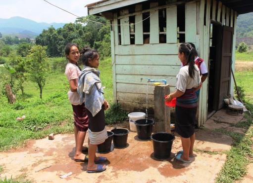 Girls collecting water - Lao PDR Girls collecting water - Lao PDR